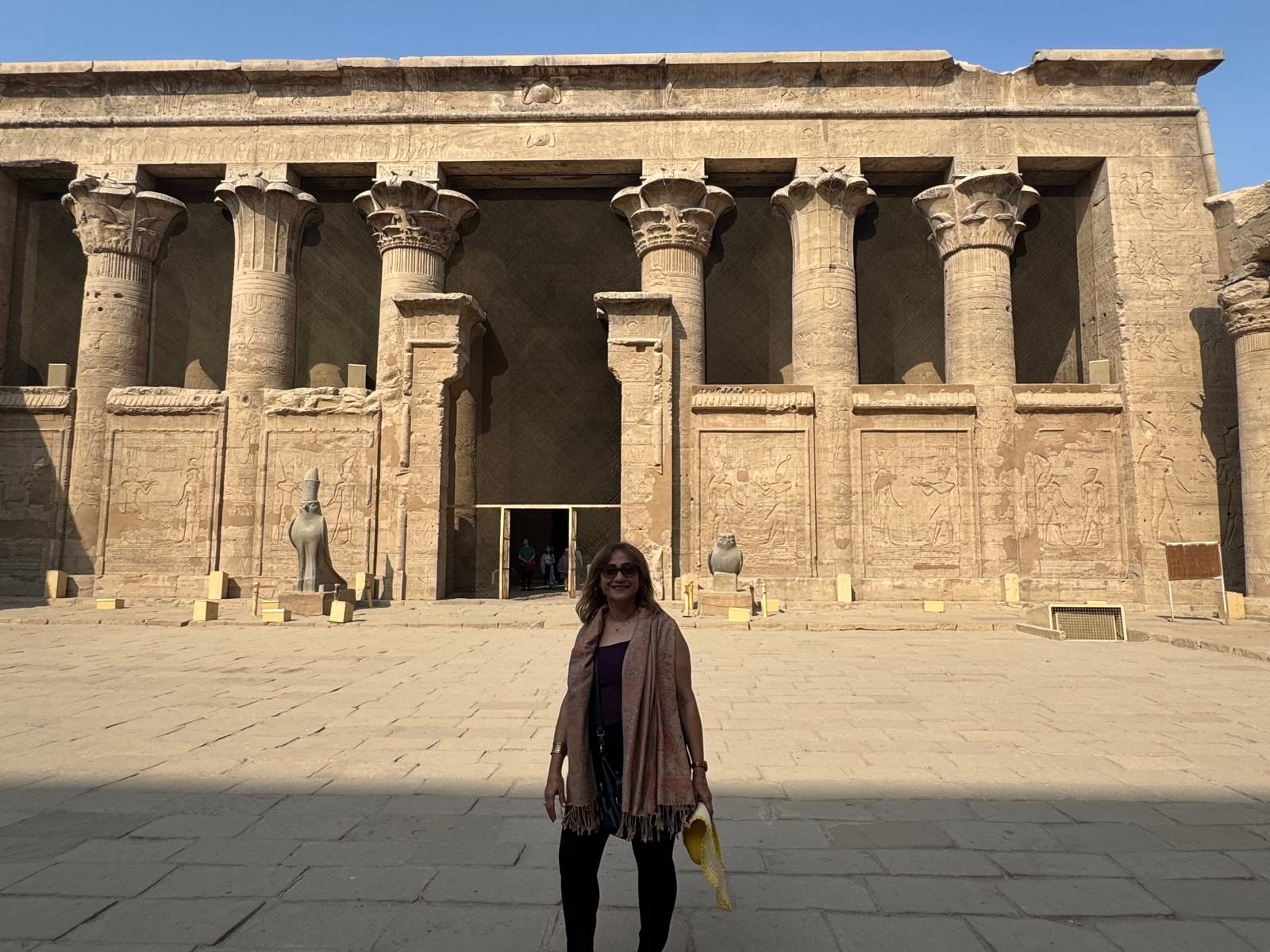 Maha Maurice, Founder & CEO of Noble Travel, in front of the Temple of Horus at Edfu